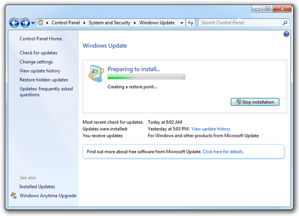 Dialog box showing the Windows Update preparing to install, and creating a restore point